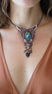 Necklace with a Labradorite stone worn by a person